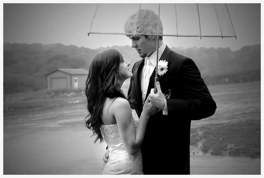 Bride and Groom Just Married in the rain photo